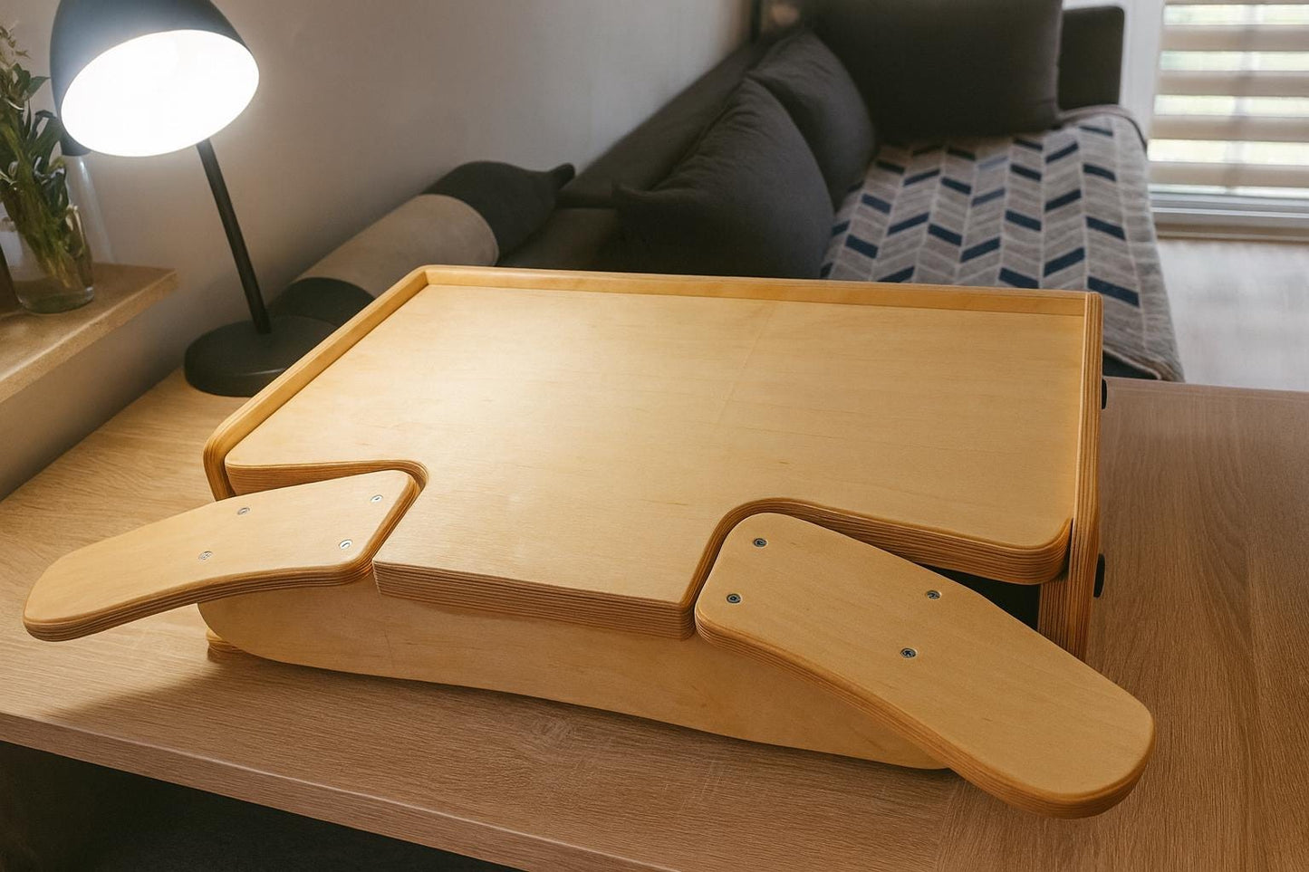 Desktop workbench for watchmaking and jewelry work, featuring adjustable tabletop height, ergonomic armrests and solid plywood build.