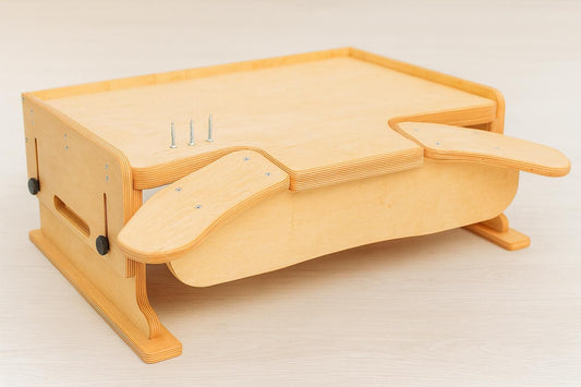 Desktop workbench for watchmaking and jewelry work, featuring adjustable tabletop height, ergonomic armrests and solid plywood build.